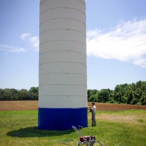 Franklin Silo Repair in the process of painting this "backyard" silo.