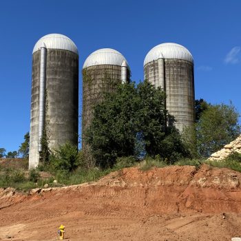 Large silos in brush